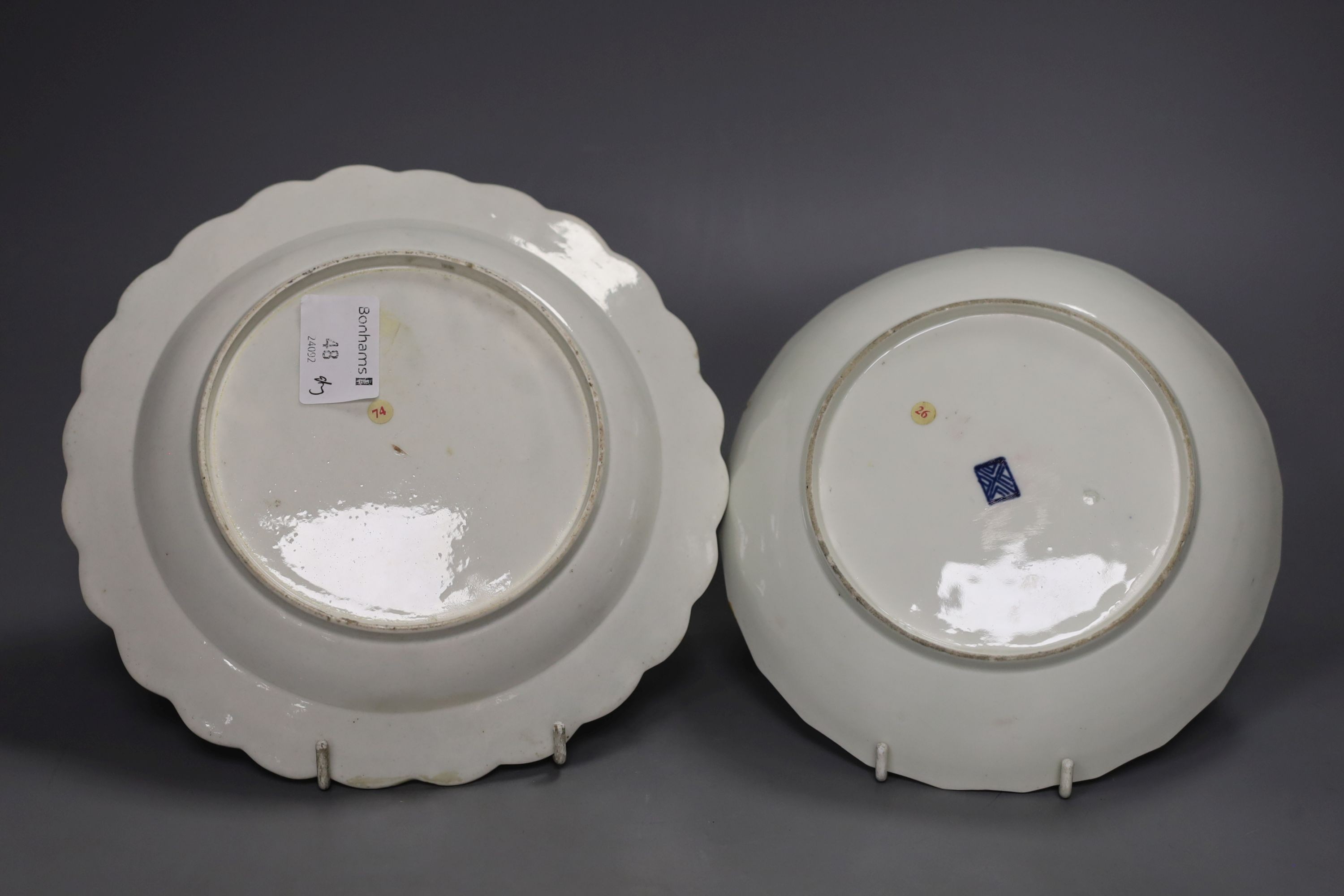 A Worcester plate with two turquoise borders, the centre painted with flowers, a saucer dish with fan shaped panels painted with flowers separated by blue panels and a claret ground plate, turquoise plate 21 cms diameter